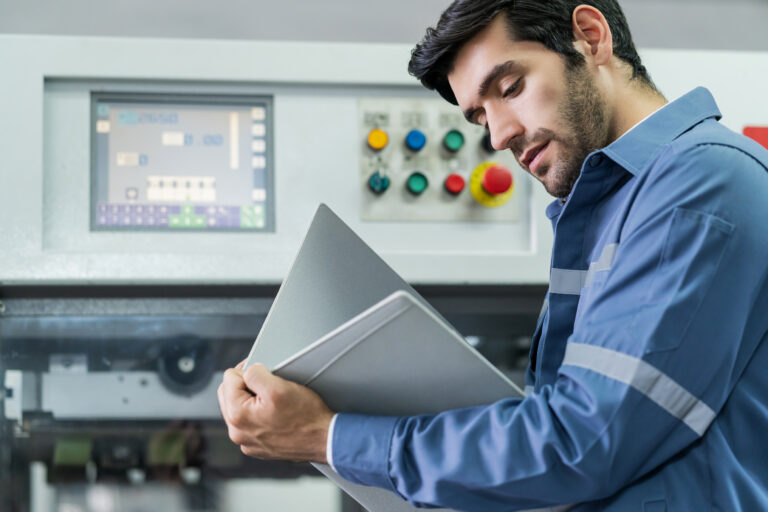 male caucasian professional engineer examine checking machinery system progress work flow result project factory background industrial technology concept