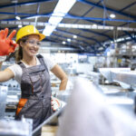 portrait female factory worker showing okay sign 1