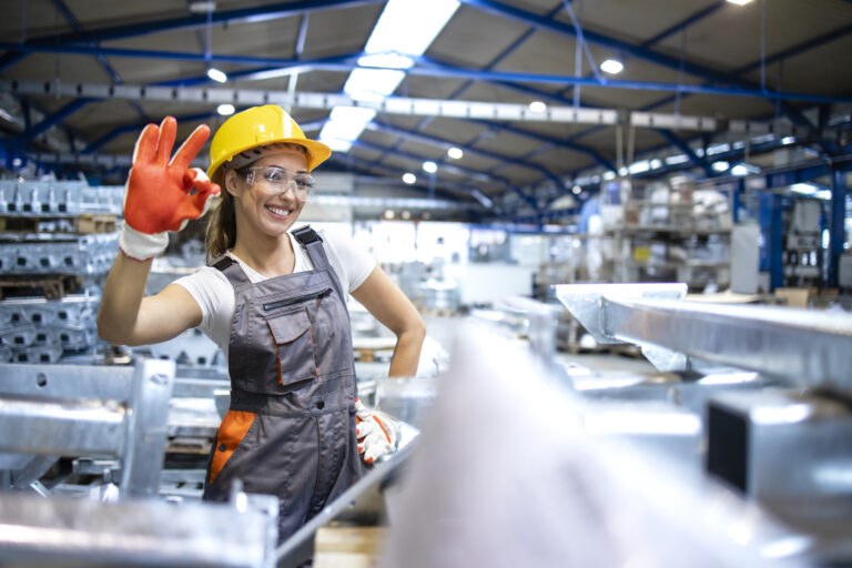 portrait female factory worker showing okay sign 1