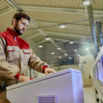 view worker using automated woodworking machine production facility