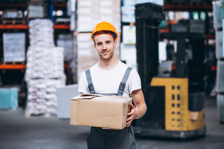 young man working warehouse with boxes